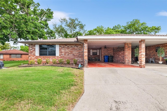 view of front facade featuring a carport and a front lawn