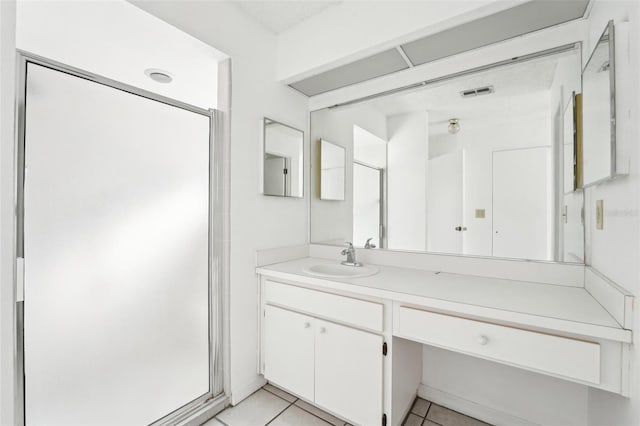 bathroom featuring tile patterned floors and vanity