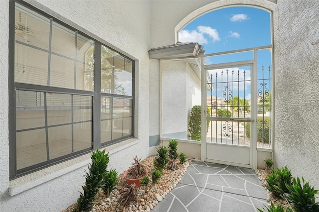 unfurnished sunroom featuring a wealth of natural light