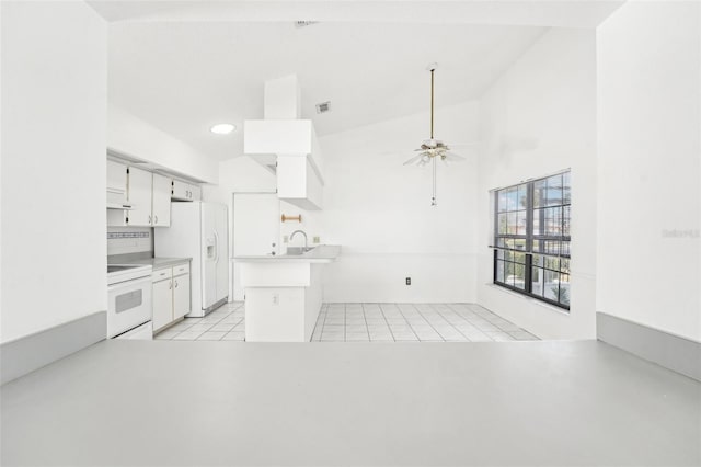 kitchen with white appliances, white cabinets, ceiling fan, light tile patterned floors, and kitchen peninsula