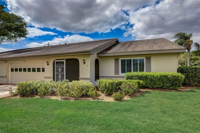 ranch-style house featuring a front lawn and a garage