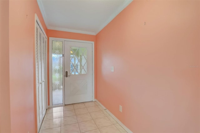 tiled entrance foyer with ornamental molding