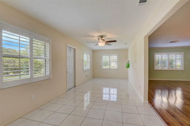 unfurnished room featuring light hardwood / wood-style floors and ceiling fan