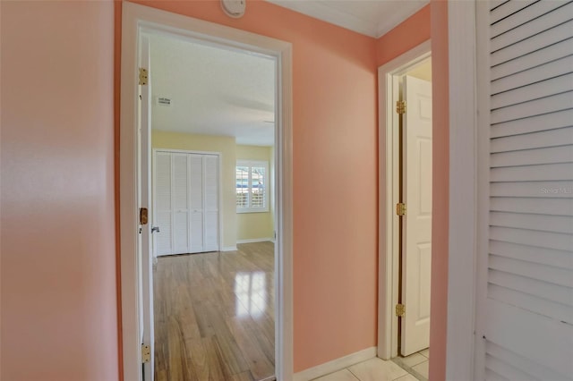 corridor with light hardwood / wood-style floors