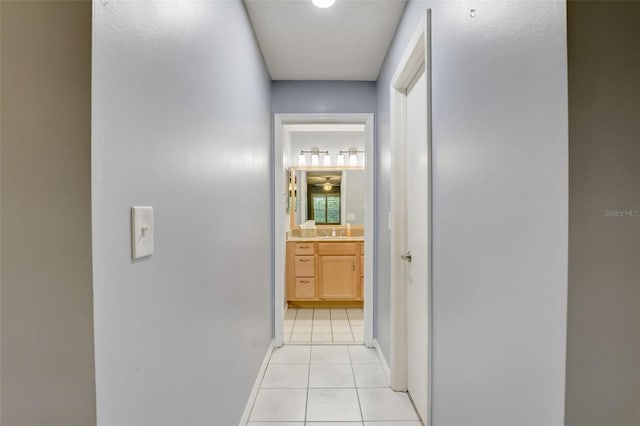 corridor with light tile floors