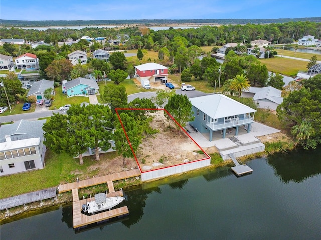 bird's eye view with a residential view and a water view