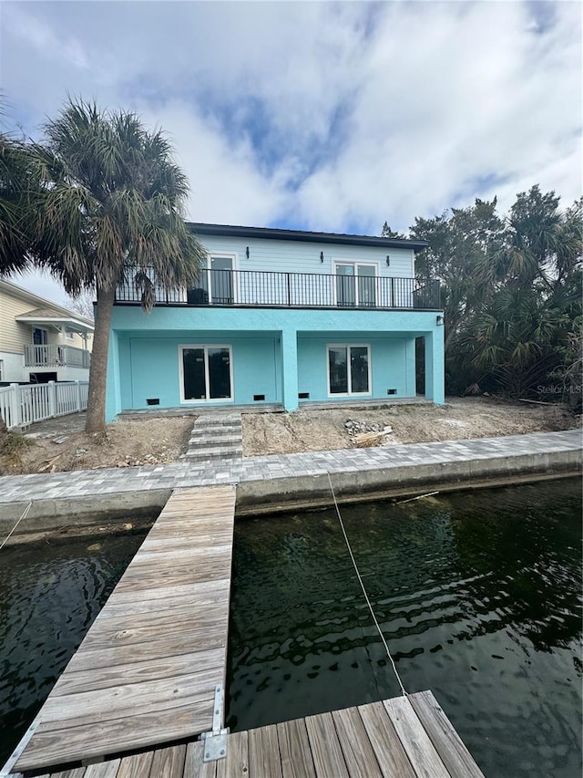 view of dock with a balcony