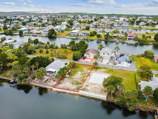 bird's eye view featuring a residential view and a water view