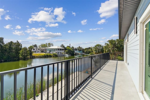 3380 Holly Springs Dr, Hernando Beach, FL 34607 - balcony featuring a water view and a residential view