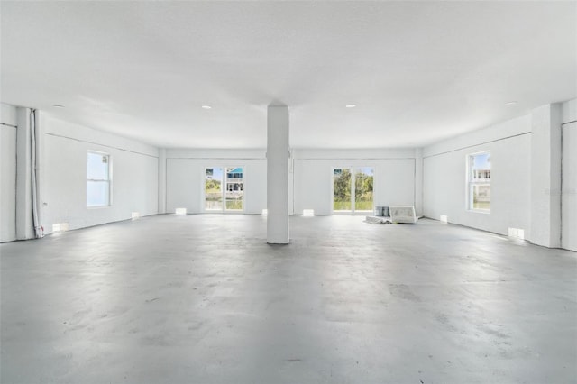 3380 Holly Springs Dr, Hernando Beach, FL 34607 - unfurnished living room with concrete flooring
