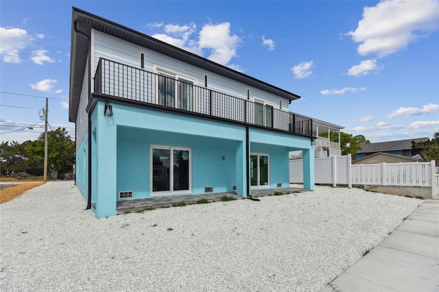 3380 Holly Springs Dr, Hernando Beach, FL 34607 - back of house with a balcony and a patio area