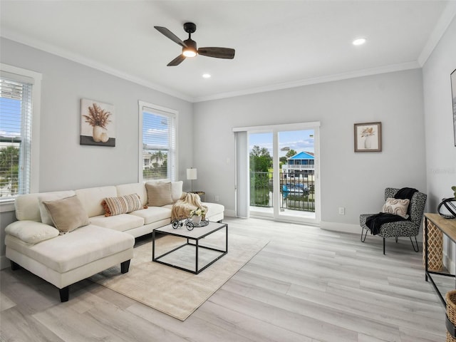 3380 Holly Springs Dr, Hernando Beach, FL 34607 - living room featuring ornamental molding, healthy amount of natural light, light wood-style flooring, ceiling fan, and recessed lighting
