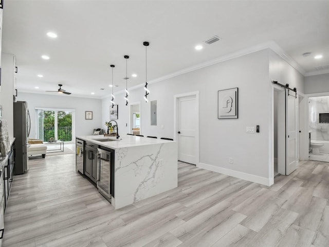 3380 Holly Springs Dr, Hernando Beach, FL 34607 - kitchen with a barn door, recessed lighting, beverage cooler, ceiling fan, and light wood finished floors