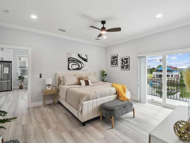 3380 Holly Springs Dr, Hernando Beach, FL 34607 - bedroom with freestanding refrigerator, access to outside, ornamental molding, light wood finished floors, and recessed lighting