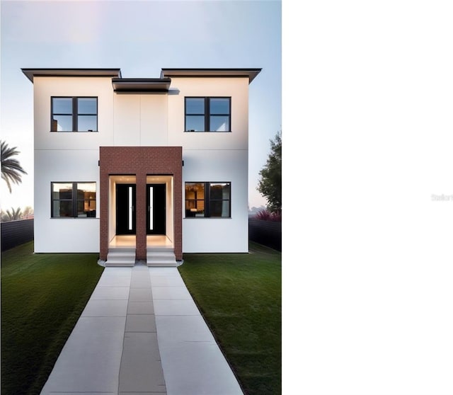 view of front of home featuring a front lawn