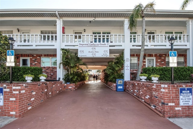 view of front of house featuring a balcony