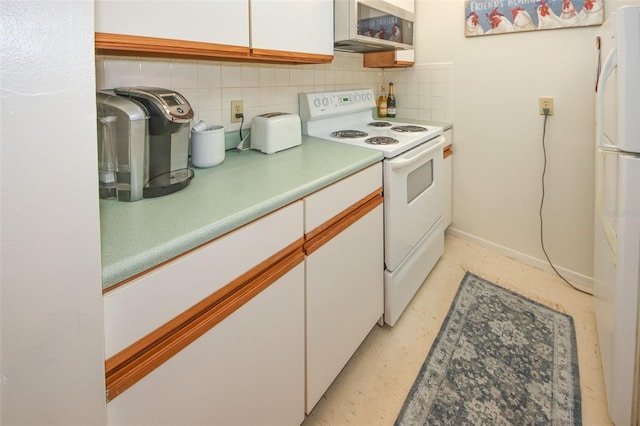 kitchen with white cabinets, tasteful backsplash, and white appliances