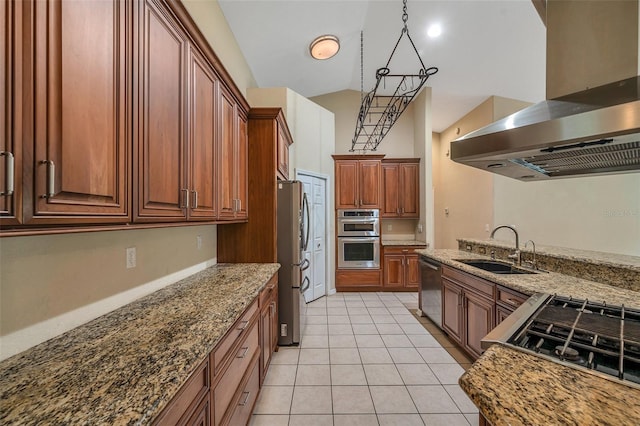 kitchen featuring island range hood, vaulted ceiling, stainless steel appliances, sink, and decorative light fixtures