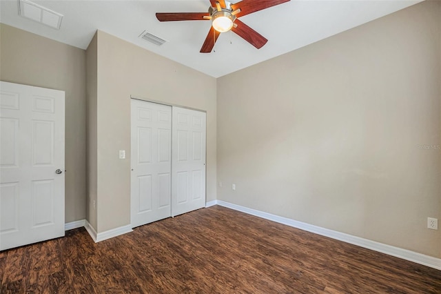 unfurnished bedroom featuring a closet, ceiling fan, and dark wood-type flooring