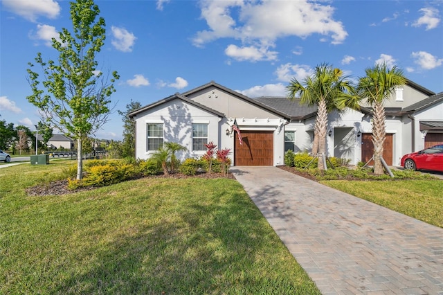 ranch-style home featuring a front yard and a garage