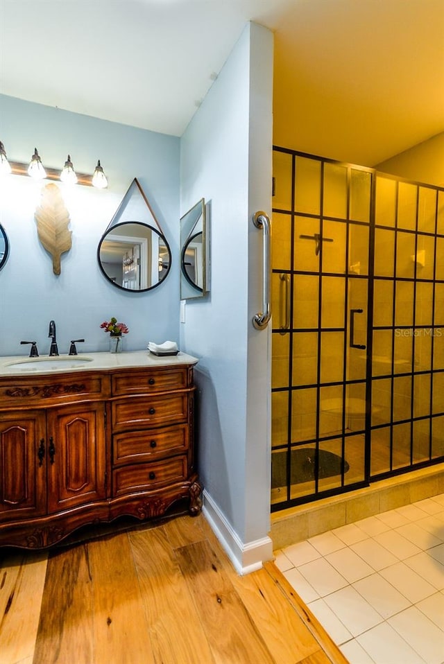 bathroom featuring hardwood / wood-style floors and vanity