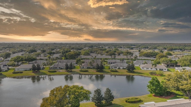 aerial view at dusk with a water view