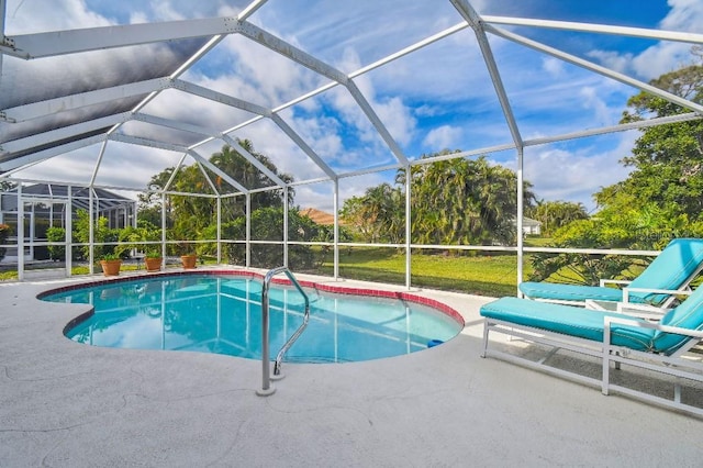 view of pool featuring a lanai and a patio