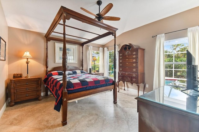 bedroom with multiple windows, light tile floors, ceiling fan, and vaulted ceiling