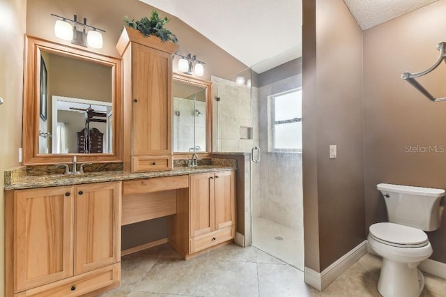 bathroom with toilet, a shower with shower door, double sink, vanity with extensive cabinet space, and tile floors