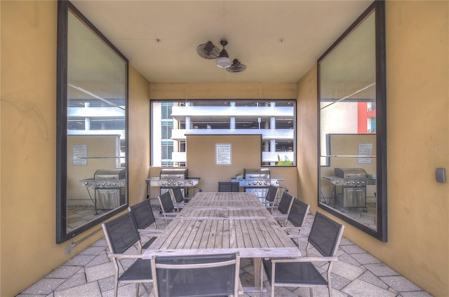 view of patio with ceiling fan and grilling area