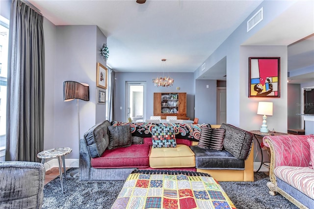 living room featuring a notable chandelier