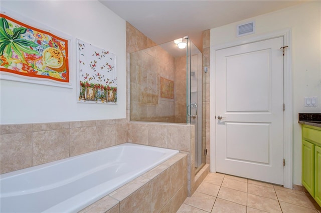 bathroom featuring vanity, shower with separate bathtub, and tile flooring