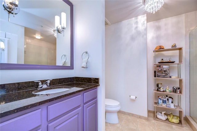 bathroom with a shower with door, toilet, tile flooring, and vanity