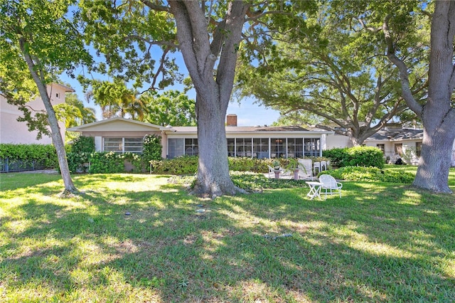 exterior space with a yard