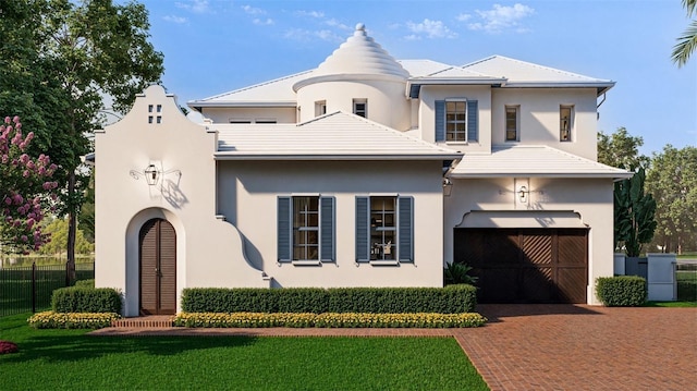 view of front of home featuring decorative driveway, fence, a front lawn, and stucco siding