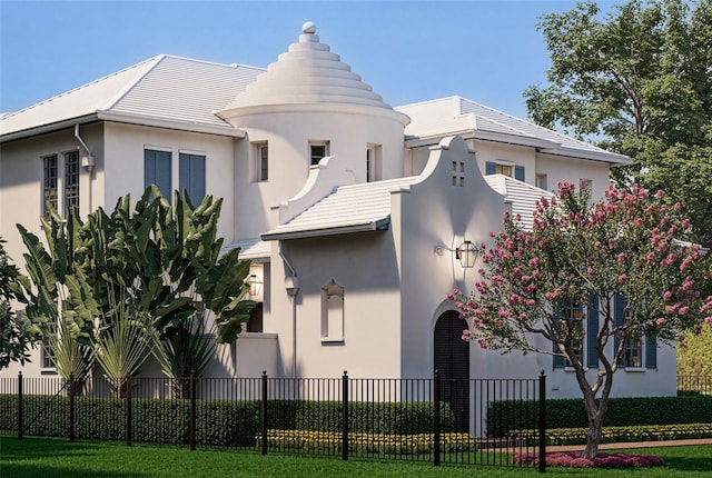 view of front of home with fence and stucco siding