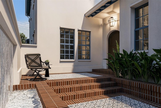 doorway to property with stucco siding