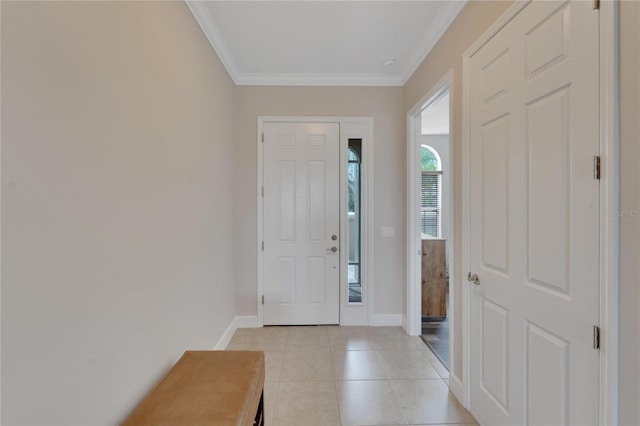 entrance foyer with light tile flooring and ornamental molding