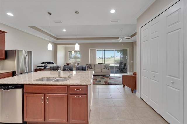 kitchen with stainless steel appliances, decorative light fixtures, light tile flooring, ceiling fan, and sink