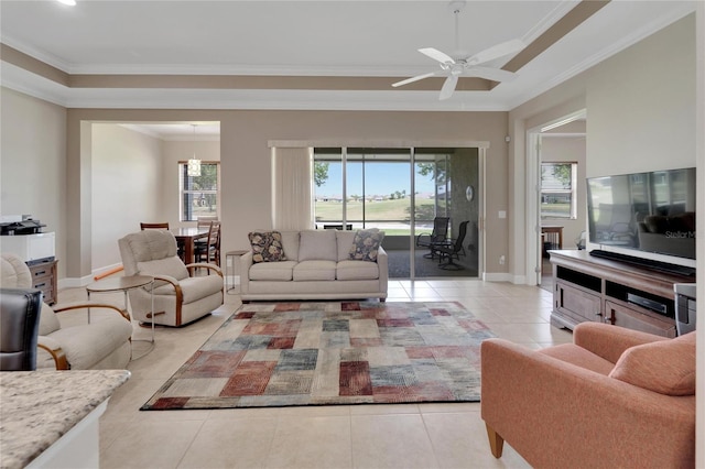 living room with light tile floors, crown molding, and ceiling fan