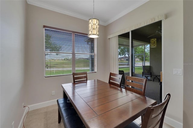 tiled dining area featuring ornamental molding