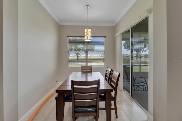 dining space with light tile floors and crown molding