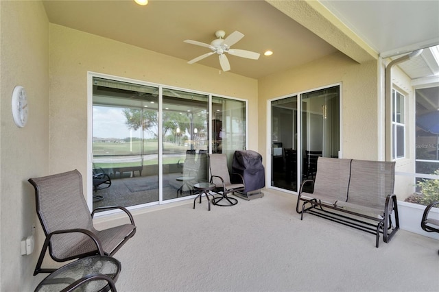 view of terrace featuring ceiling fan