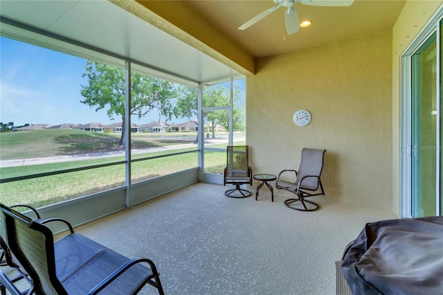 sunroom / solarium with ceiling fan