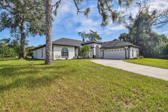 ranch-style house featuring a front yard and a garage