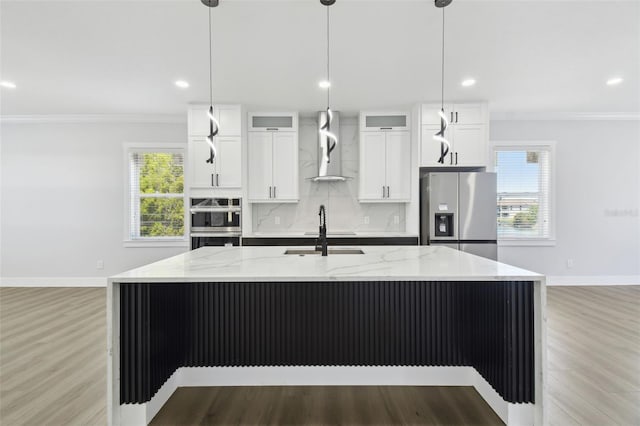 3230 Azalea Dr Lot 13, Hernando Beach, FL 34607 - kitchen with crown molding, a sink, an island with sink, stainless steel appliances, and wall chimney exhaust hood