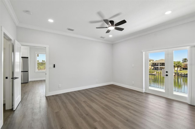 3230 Azalea Dr Lot 13, Hernando Beach, FL 34607 - unfurnished room with dark wood-type flooring, visible vents, ornamental molding, and french doors