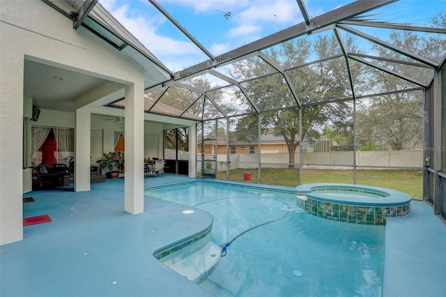 view of pool featuring ceiling fan, an in ground hot tub, a patio, and glass enclosure