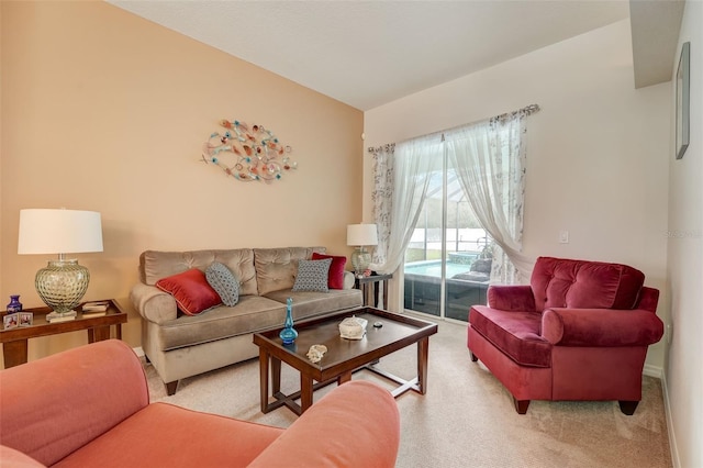 carpeted living room with vaulted ceiling