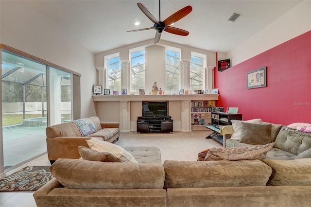 living room with ceiling fan, light carpet, and lofted ceiling